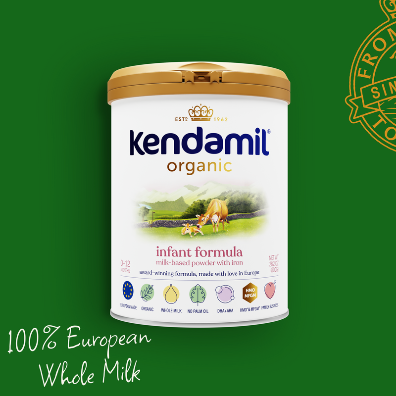Kendamil organic infant formula powder container on a green background